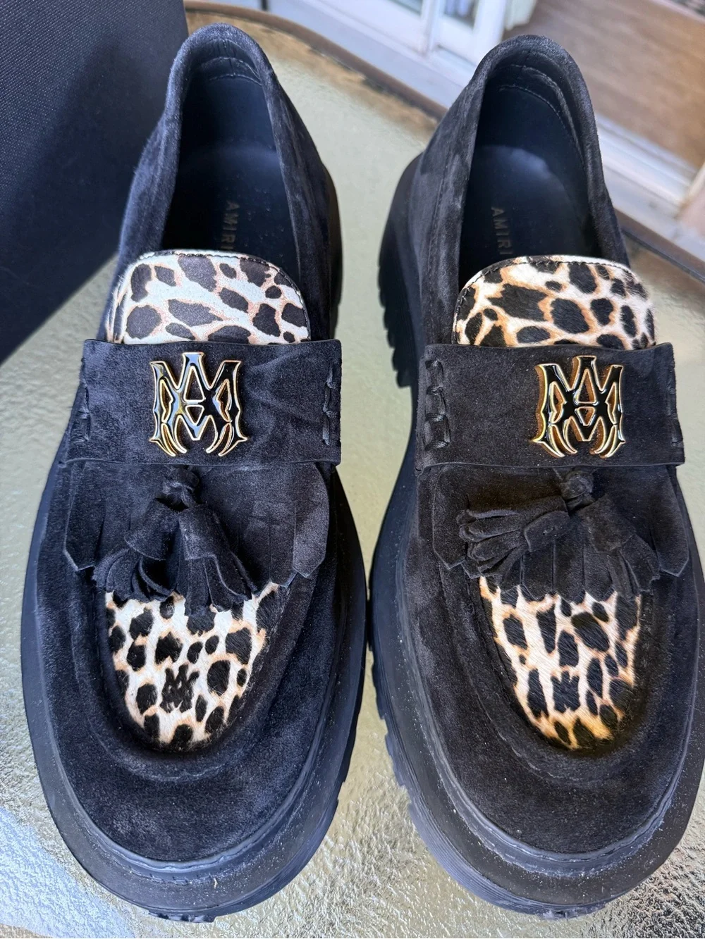 AMIRI Black Suede Tassel Loafers with Leopard Accent and Gold Crest